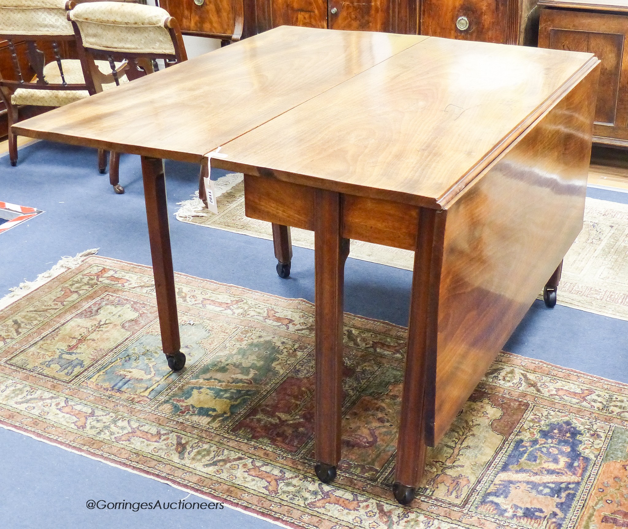 A George III mahogany drop leaf dining table. 151cm extended, D-120, H-75cm